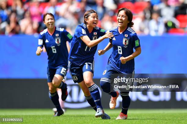 Mana Iwabuchi of Japan celebrates with teammates after scoring her team's first goal during the 2019 FIFA Women's World Cup France group D match...