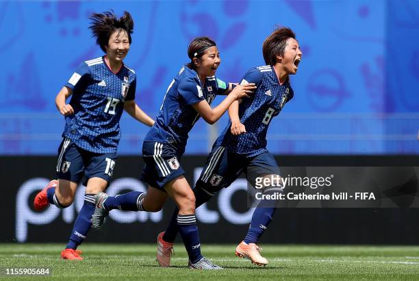 Mana Iwabuchi of Japan celebrates with teammates after scoring her team's first goal during the 2019 FIFA Women's World Cup France group D match...