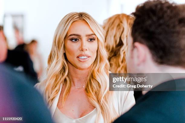 Petra Ecclestone talks with John Russo at the Maddox Gallery Los Angeles Presents: "The Disrupters" by David Yarrow on June 13, 2019 in West...