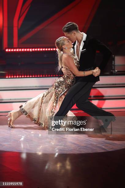 Evelyn Burdecki and Evgeny Vinokurov perform on stage during the finals of the 12th season of the television competition "Let's Dance" on June 14,...