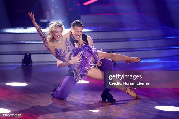 Ella Endlich and Valentin Lusin perform on stage during the finals of the 12th season of the television competition "Let's Dance" on June 14, 2019 in...
