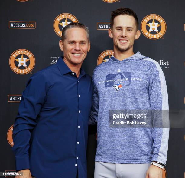 Hall of Famer and former Houston Astro Craig Biggio and his son Cavan Biggio of the Toronto Blue Jays pose for a photo after a press conference at...