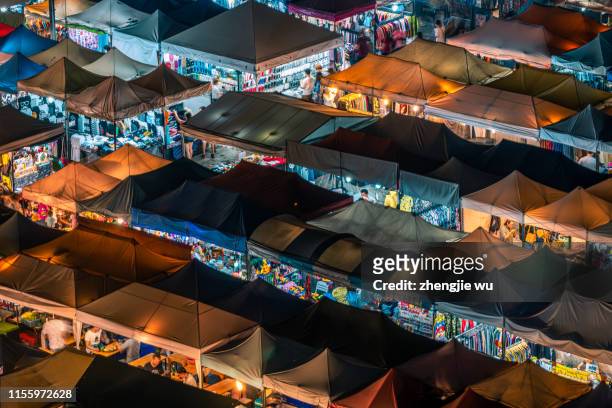 the train night market ratchada at bangkok,thailand - sunset moth stock-fotos und bilder