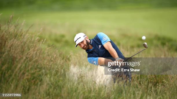 Dustin Johnson of the United States plays a shot from a bunker on the third hole during the second round of the 2019 U.S. Open at Pebble Beach Golf...