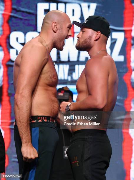 Boxers Tyson Fury and Tom Schwarz face off during a ceremonial weigh-in at MGM Grand Garden Arena on June 14, 2019 in Las Vegas, Nevada. The two will...