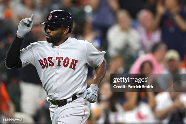 Jackie Bradley Jr. #19 of the Boston Red Sox celebrates his two-run home run against the Baltimore Orioles during the fifth inning at Oriole Park at...