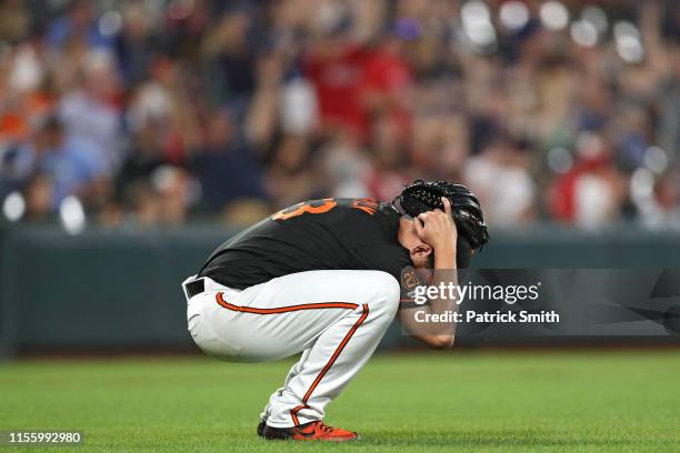 Pitcher Dan Straily of the Baltimore Orioles reacts after allowing a two-run home run to Michael Chavis of the Boston Red Sox during the fifth inning...