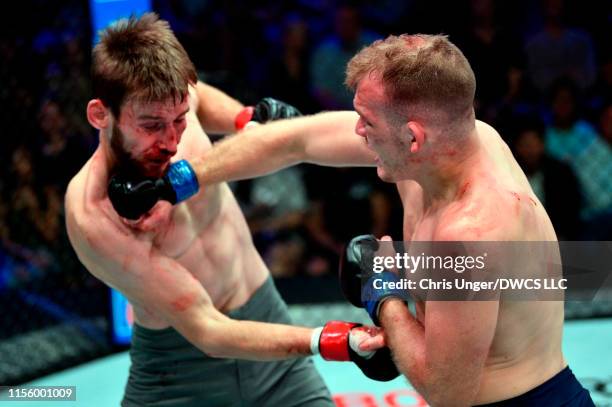 Kevin Syler of Bolivia punches Lance Lawrence in their featherweight bout during Dana White's Contender Series at the UFC Apex on July 16, 2019 in...