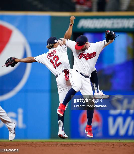 Francisco Lindor and Tyler Naquin of the Cleveland Indians celebrate an 8-0 victory over the Detroit Tigers at Progressive Field on July 16, 2019 in...