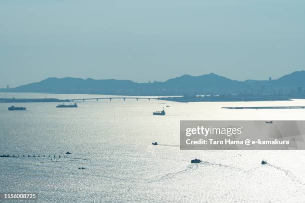 ships sailing on seto inland sea in kobe - kobe japan stock pictures, royalty-free photos & images