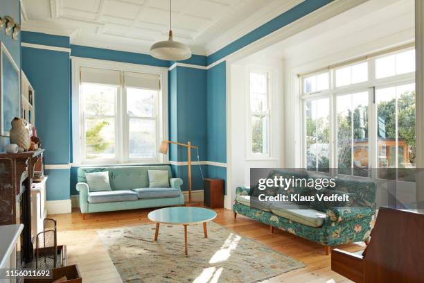 furniture arranged in living room - house windows stock-fotos und bilder