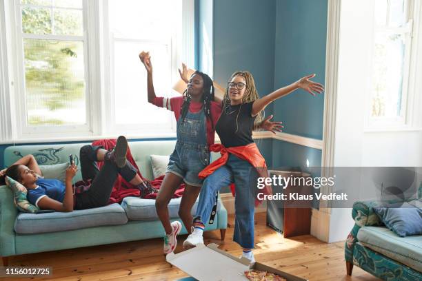 friends dancing while woman using phone - afroamerikansk kultur bildbanksfoton och bilder