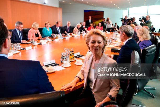 German Defence Minister Ursula von der Leyen poses for photographers during her last weekly cabinet meeting on July 17, 2019 at the Chancellery in...