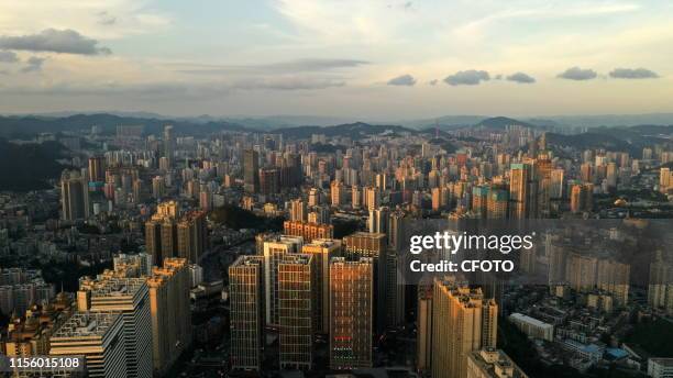 Aerial photo shows the twin towers of Huaguoyuan in guiyang, southwest China's guizhou province, July 16, 2019.- PHOTOGRAPH BY Costfoto / Future...