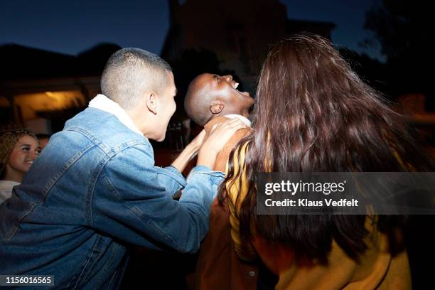 happy friends enjoying dancing at night - three people dancing stock pictures, royalty-free photos & images