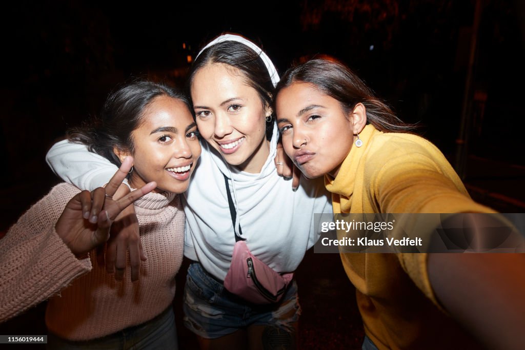 Female friends enjoying outdoors at night