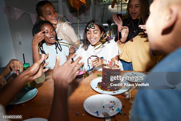 happy friends enjoying birthday at home - birthday party stockfoto's en -beelden