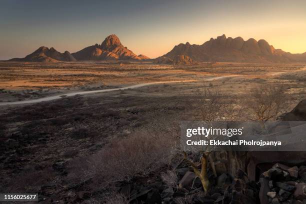 landscape photo of the spitzkoppe granite mountains at sunrise,namibia - kolmanskop namibia stock pictures, royalty-free photos & images