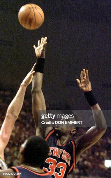 New York Knicks Patrick Ewing gets off a shot against the Indiana Pacers during the NBA Eastern Conference Finals 30 May, 1999 at Market Square arena...