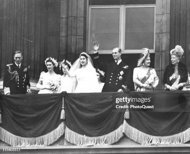 The Royal Wedding Party wave from the balcony of the Buckingham Palace, London, England, November 20, 1947. Front row, from left, King George VI ,...