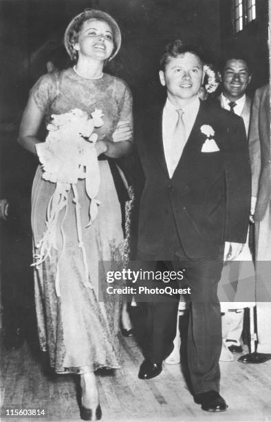 Just married actors Martha Vickers and Mickey Rooney walk down the aisle of a church after their wedding ceremony, North Hollywood, California, June...