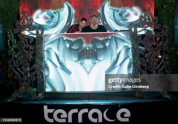 Producer Dave Bryant cheers on actor and DJ Kristian Nairn during his performance at the Rave of Thrones comic con party at The Hustler Club on June...