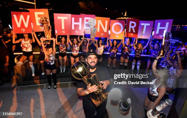 Drake carries the Larry O'Brien NBA Championship Trophy as he celebrates the Toronto Raptor's NBA championship at XS Nightclub at Wynn Las Vegas on...