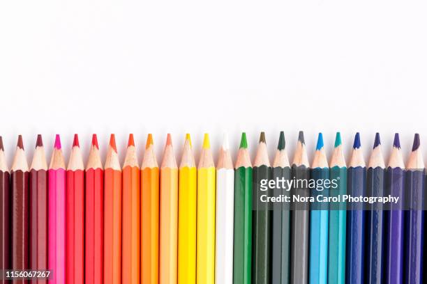 colored pencils on white background - 美術工芸用品 ストックフォトと画像