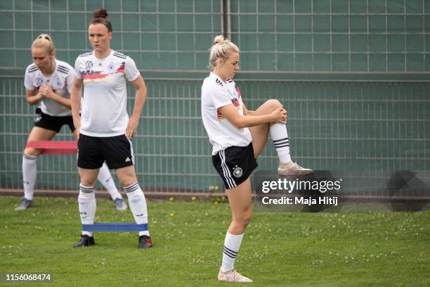 Turid Knaak , Marina Hegering and Carolin Simon of Germany warm up on during a training on June 15, 2019 in Montpellier, France.