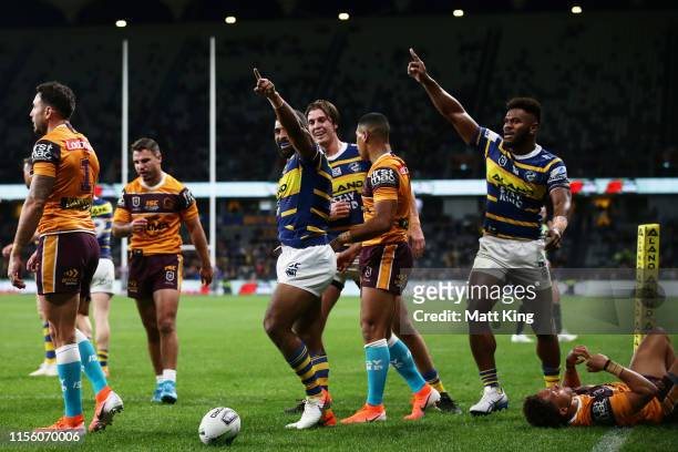 Michael Jennings of the Eels celebrates scoring a try during the round 14 NRL match between the Parramatta Eels and the Brisbane Broncos at Bankwest...