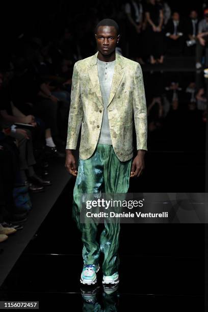 Model walks the runway at the Emporio Armani fashion show during the Milan Men's Fashion Week Spring/Summer 2020 on June 15, 2019 in Milan, Italy.