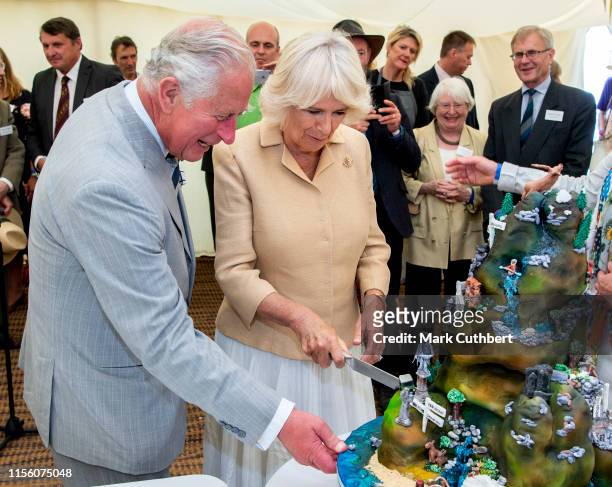 Prince Charles, Prince of Wales and Camilla, Duchess of Cornwall cut a birthday cake to celebrate the 70th anniversary of the National Parks and...