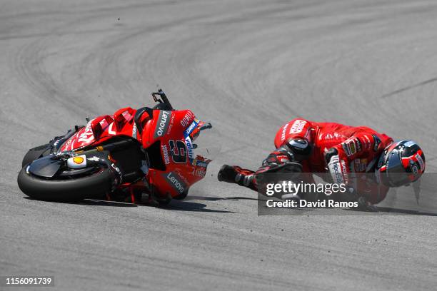 Danilo Petrucci of Italy and Mission Winnow Ducati crashes during the MotoGP Qualifying ahead of MotoGP Gran Premi Monster Energy de Catalunya at...