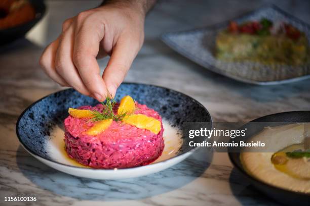 chef placing food - middle eastern food stock pictures, royalty-free photos & images