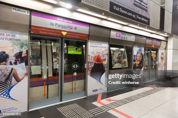 dhoby ghaut mrt station in singapore - mrt train stock pictures, royalty-free photos & images