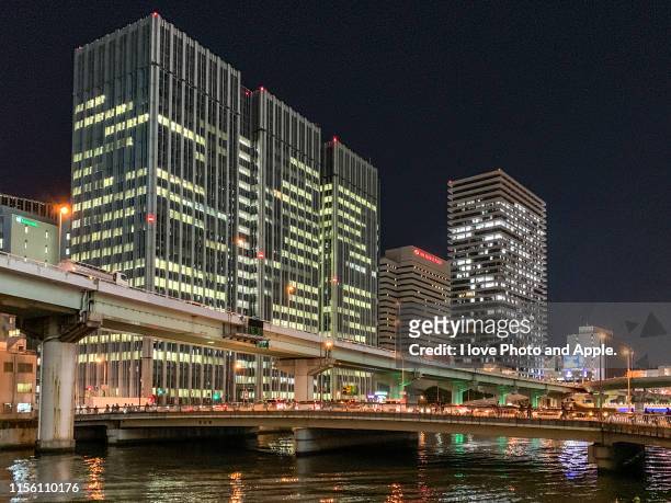 night view of downtown osaka along the dojima river - 大阪市 fotografías e imágenes de stock