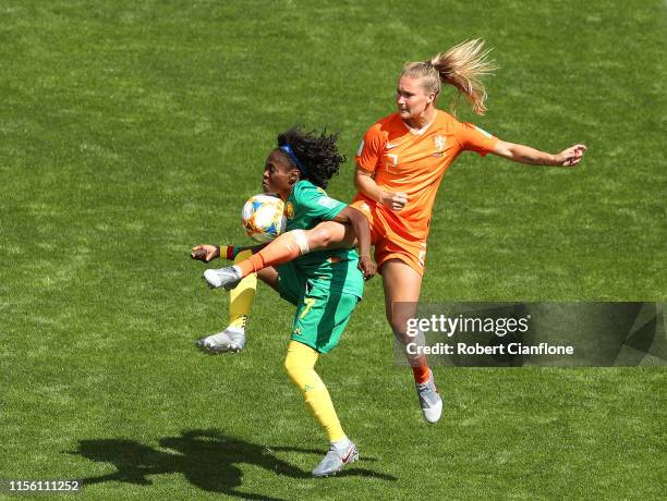 Gabrielle Aboudi Onguene of Cameroon is challenged by Desiree Van Lunteren of the Netherlands during the 2019 FIFA Women's World Cup France group E...