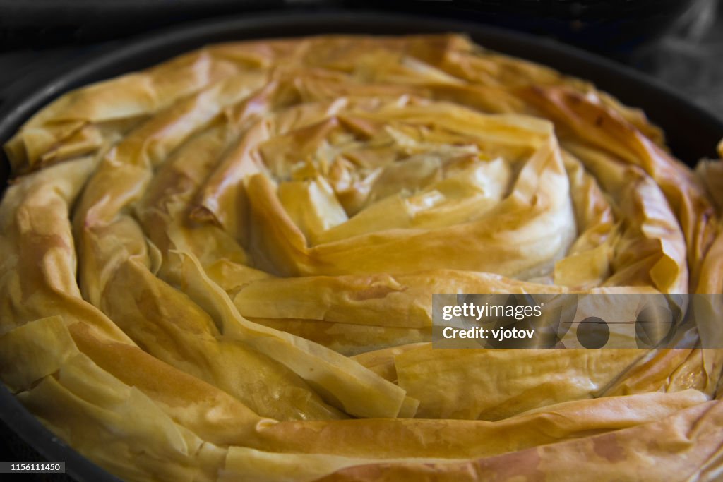 Traditional homemade spiral shape banitsa borek - Bulgarian burek