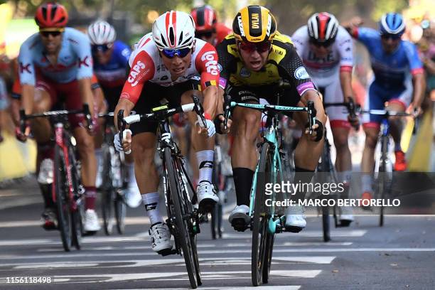 Australia's Caleb Ewan frontL), past Netherlands' Dylan Groenewegen, wins on the finish line of the eleventh stage of the 106th edition of the Tour...