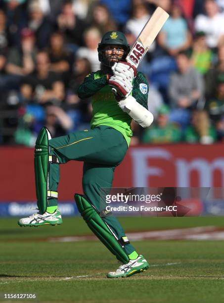 South Africa batsman Hashim Amla hits out during the Group Stage match of the ICC Cricket World Cup 2019 between South Africa and Afghanistan at...