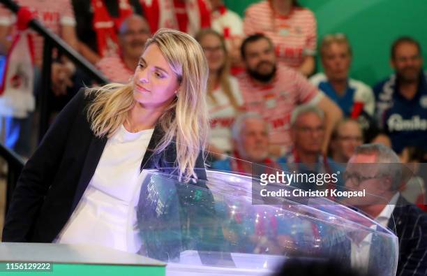 Nia Kuenzer, former player of Germany drwas the matches during the DFB Cup 2019/20 First Round Draw at Deutsches Fussballmuseum on June 15, 2019 in...
