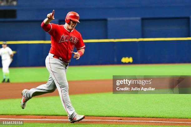 Justin Bour of the Los Angeles Angels of Anaheim points to the crowd after hitting a home run off of Charlie Morton of the Tampa Bay Rays in the...