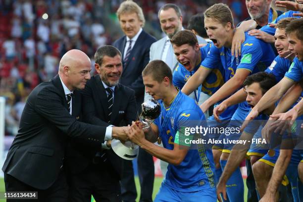 President, Gianni Infantino presents Valerii Bondar of Ukraine with the FIFA U-20 World Cup Trophy following the 2019 FIFA U-20 World Cup Final...