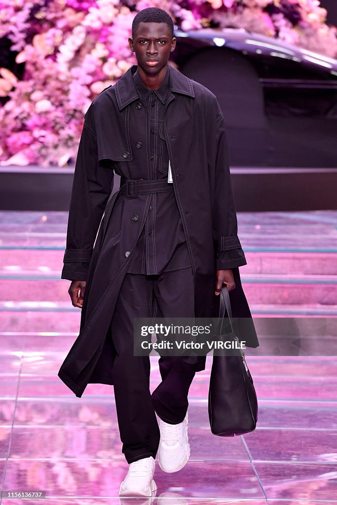 A model walks the runway at the Versace fashion show at the Milan ...