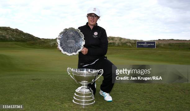 Emily Toy of England poses with the trophy following victory during the final match on day five of the R&A Womens Amateur Championship at Royal...