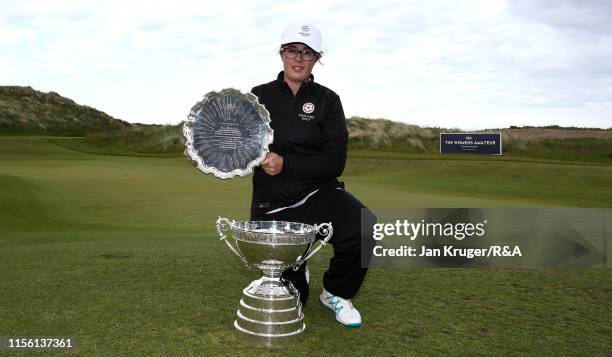 Emily Toy of England poses with the trophy following victory during the final match on day five of the R&A Womens Amateur Championship at Royal...