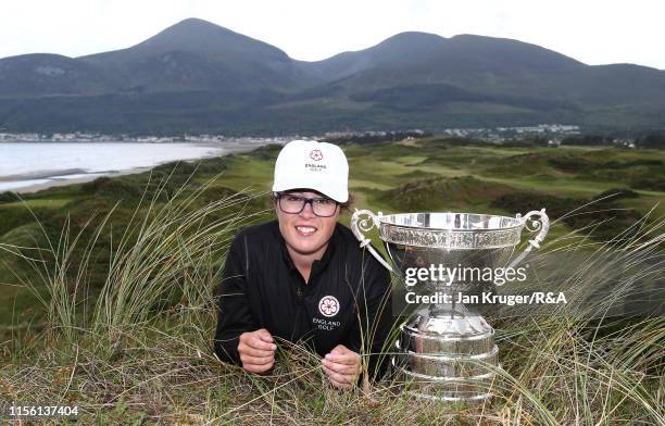 Emily Toy of England poses with the trophy following victory during the final match on day five of the R&A Womens Amateur Championship at Royal...