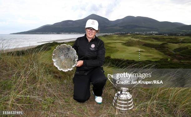 Emily Toy of England poses with the trophy following victory during the final match on day five of the R&A Womens Amateur Championship at Royal...