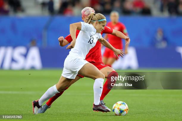 Rosie White of New Zealand is challenged by Sophie Schmidt of Canada during the 2019 FIFA Women's World Cup France group E match between Canada and...