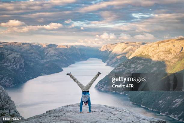 handstand, pulpit rock preikestolen, norway - handstand stock pictures, royalty-free photos & images